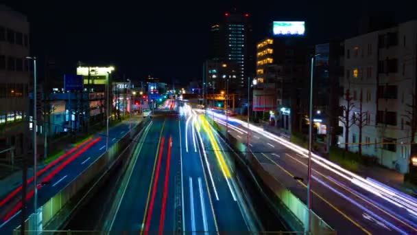 Un timelapse della strada al centro di Tokyo di notte esposizione lunga ampia colpo — Video Stock
