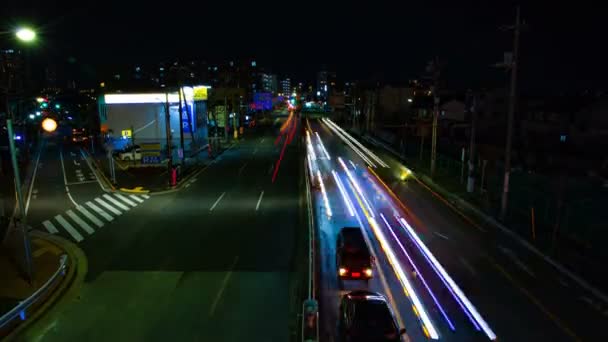 Un timelapse della strada al centro di Tokyo di notte esposizione lunga ampia colpo — Video Stock