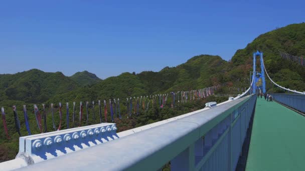 Carp streamers at Ryujin big bridge in Ibaraki daytime sunny — Stock Video