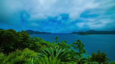 Amami oshima Kagoshima mavi okyanus yakınında promontory bir timelapse