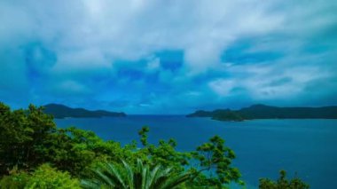 Amami oshima Kagoshima mavi okyanus yakınında promontory bir timelapse
