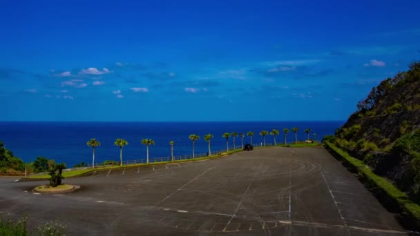 Временной отрезок мыса у панорамного океана в Амами Осима — стоковое видео