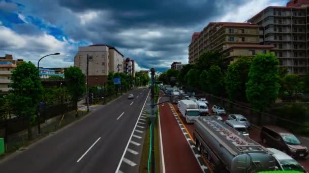 Sebuah tiLapse jalan mobil di jalan Kanpachi di Tokyo siang hari tembakan lebar — Stok Video