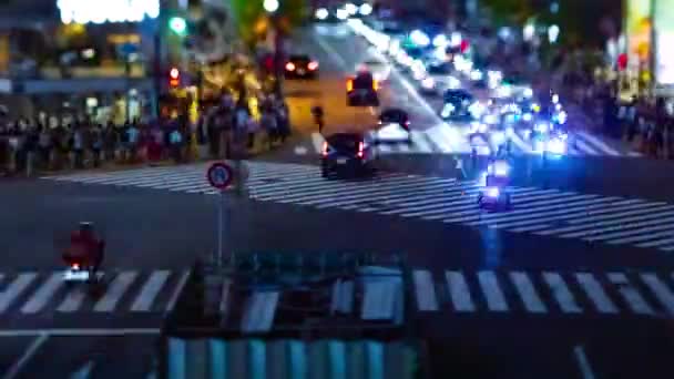 A timelapse of the scramble crossing at the neon town in Shibuya Tokyo tilt shift — Stock Video