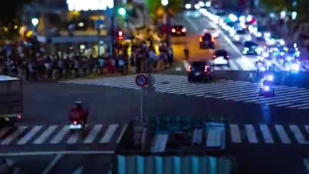 A timelapse of the scramble crossing at the neon town in Shibuya Tokyo tilt shift — Stock Video