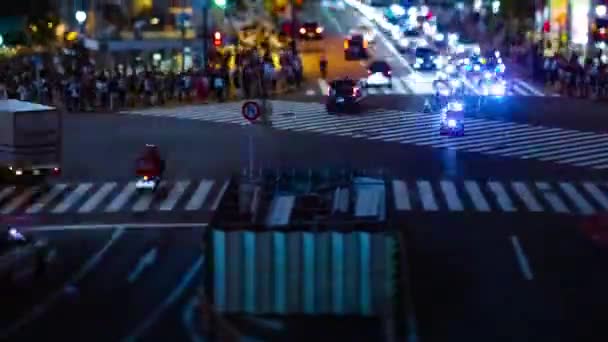 A timelapse of the scramble crossing at the neon town in Shibuya Tokyo tilt shift — Stock Video