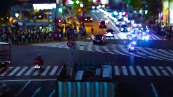 A timelapse of the scramble crossing at the neon town in Shibuya Tokyo tilt shift — Stock Video
