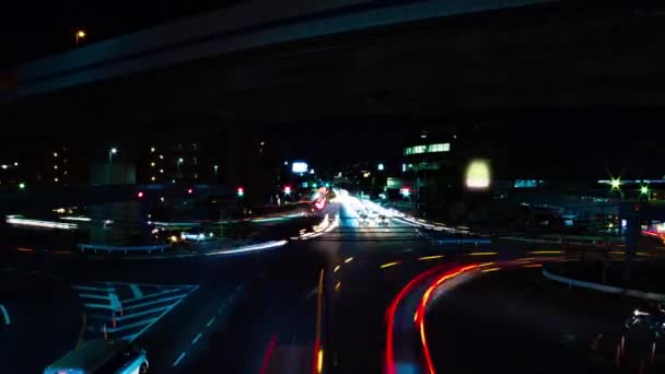 Un lapso de tiempo nocturno de la calle de la ciudad en el centro de Setagaya Tokio tiro ancho — Vídeo de stock