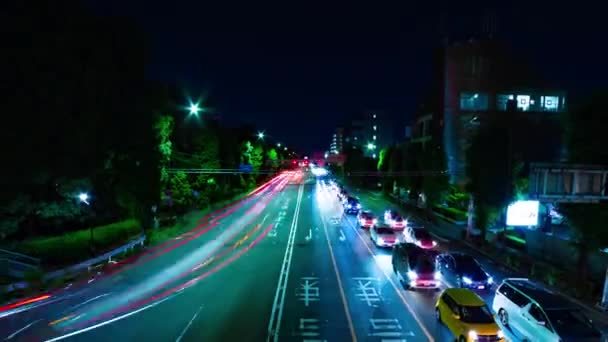 Un lapso de tiempo nocturno de la calle de la ciudad en el centro de Setagaya Tokio tiro ancho — Vídeos de Stock