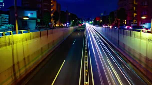 Un lapso de tiempo nocturno de la calle de la ciudad en el centro de Setagaya Tokio tiro ancho — Vídeos de Stock