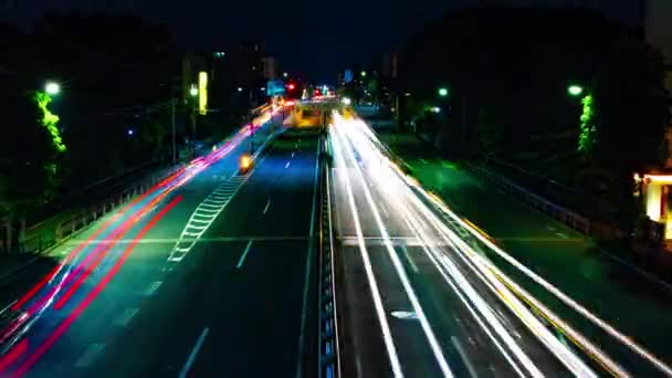 Un lapso de tiempo nocturno de la calle de la ciudad en el centro de Setagaya Tokio tiro ancho — Vídeos de Stock