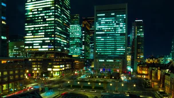 A timelapse of cityscape at the urban city in front of Tokyo station panning — Stock Video