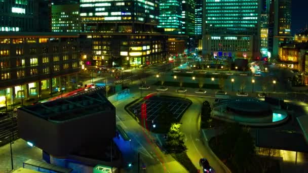 Uma cronologia da paisagem urbana na cidade urbana em frente à estação de Tóquio panning — Vídeo de Stock