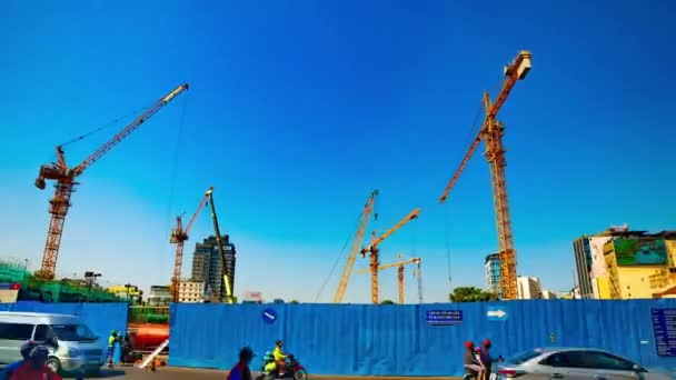 A timelapse of moving cranes at the under construction in Ho Chi Minh wide shot zoom — Stock Video