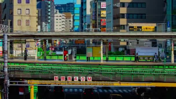 A timelapse of traffic jam at Iidabashi station in Tokyo daytime long shot zoom — Stock Video