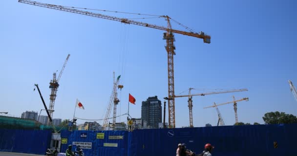 Moving cranes at the under construction in Ho Chi Minh Vietnam wide shot — Stock Video