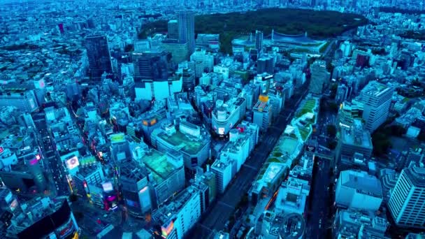 Ένα dusk timelapse πανοραμική cityscape στην περιοχή Shibuya υψηλής γωνίας ευρεία κλίση shot — Αρχείο Βίντεο