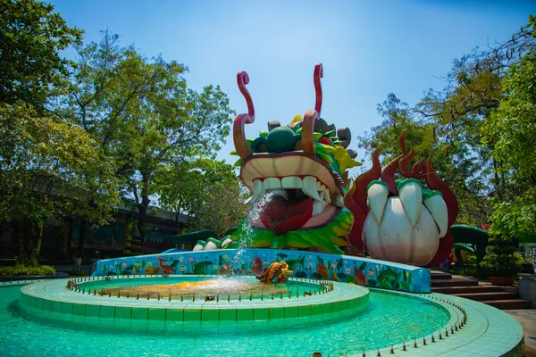A big statue dragon at Suoi Tien park in Ho Chi Minh Vietnam wide shot