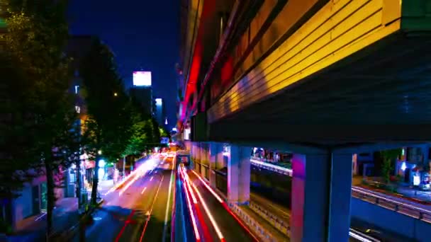 Een avond timelapse van de stad straat in Tokio wijd schot panning — Stockvideo