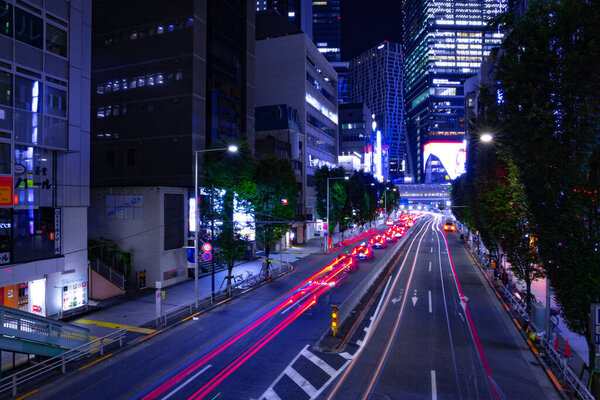 A night urban city street in Shibuya Tokyo wide shot. Shibuya district Shibuya Tokyo / Japan - 10.08.2020