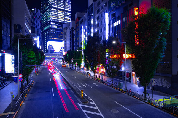 A night urban city street in Shibuya Tokyo wide shot. Shibuya district Shibuya Tokyo / Japan - 10.08.2020
