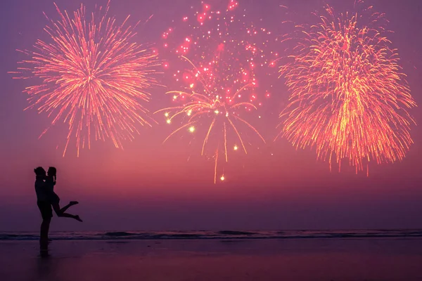 happy couple on the beach enjoying the sunset: concept of independence of america and valentines day
