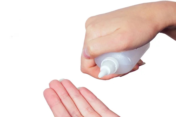 Mani utilizzando sapone liquido cosmetico spray nasale e collirio da vicino — Foto Stock