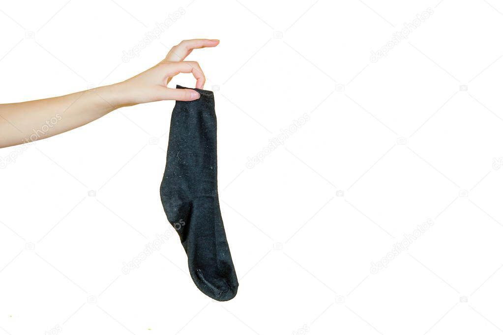 old smelly holey sock in hand on a white isolate background