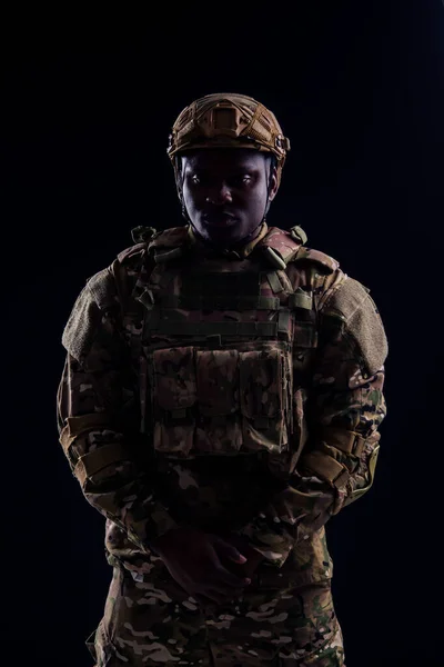 Military army african male camouflage suit sorrow black background studio — Stock Photo, Image