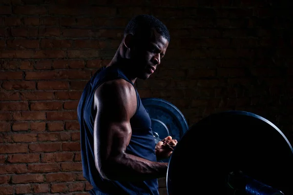 African american man with dumbbell weight training equipment gym — Stok Foto
