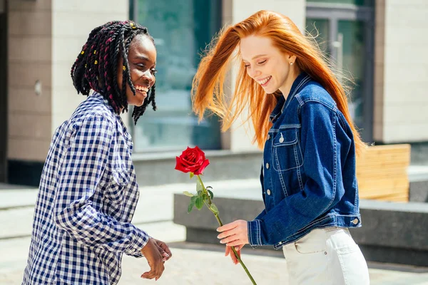 caucasian redhaired ginger woman ask her brazilian girlfriend to be her wife