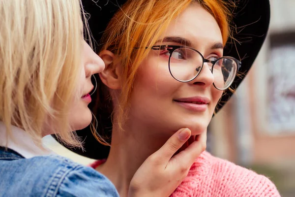 Redhaired young ginger woman feeling love to her blonde girlfriend in Europe streets — Stock Photo, Image