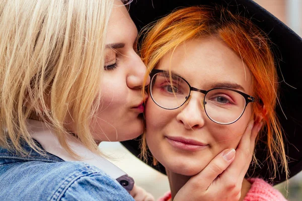 Redhaired young ginger woman feeling love to her blonde girlfriend in Europe streets — Stock Photo, Image