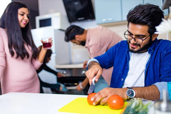 indian friends cooling together health food kitchen