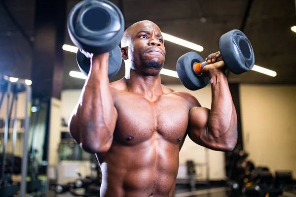 Active african american handsome male training muscles arm workout gym — Stock Photo, Image