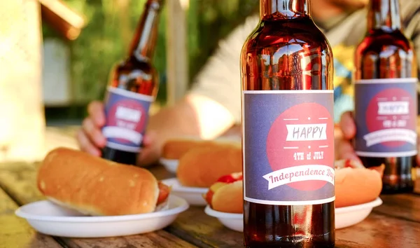 4th of July celebration party, young men hands holding beer bottle, holiday label design, Happy Independence day, hot dog, mustard, catchup. American flag, river recreation area. Close up, background