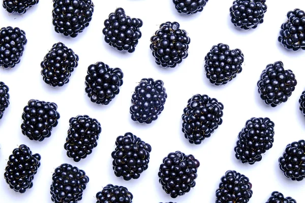 Bunch of fresh organic blueberry berries in seamless pattern on white background. Clean eating concept. Healthy nutritious vegan snack, raw diet. Close up, copy space, top view, flat lay.