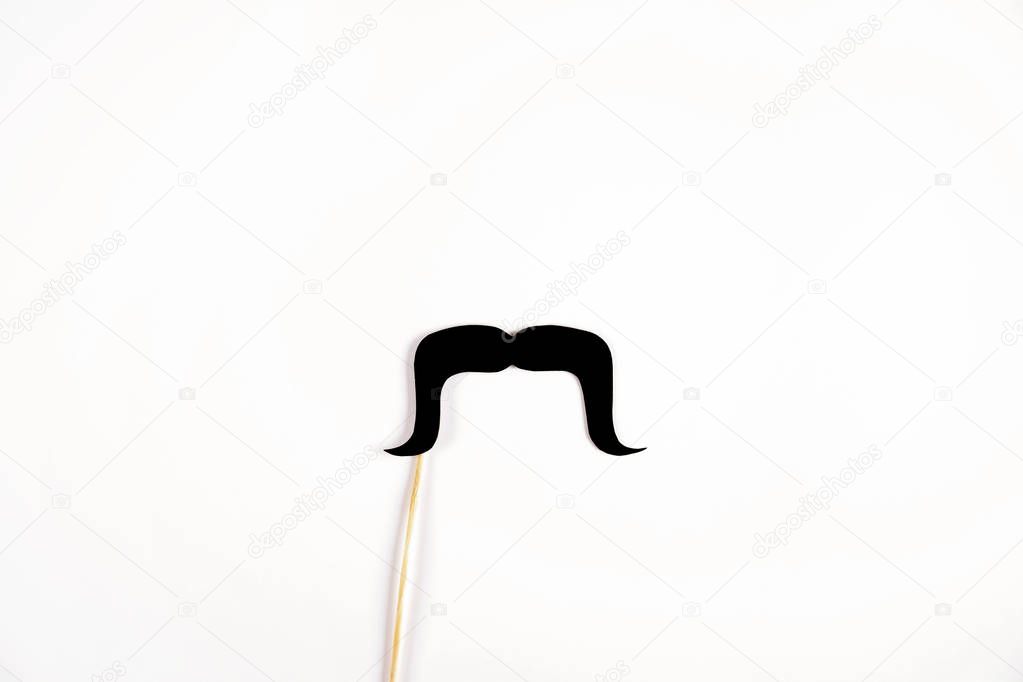 Movember concept. Annual event involving growing of moustache & beard during month in November to raise awareness of men's health issues and prostate cancer. Background, close up, copy space, flat lay