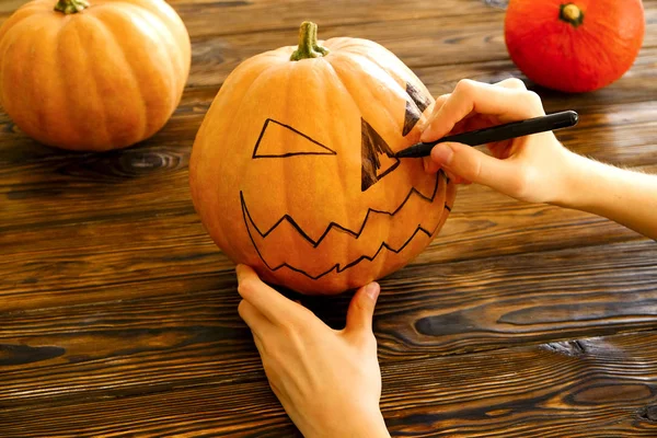 Woman Hands Drawing Scary Funny Jack Lantern Face Ripe Orange — Stock Photo, Image