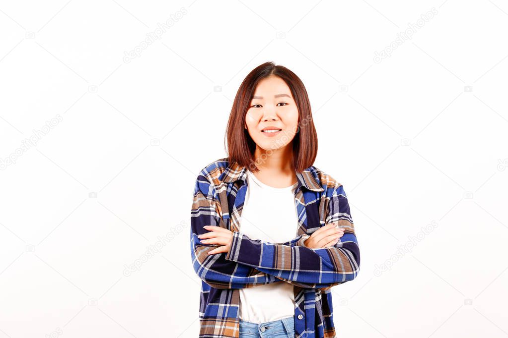 Portrait of beautiful asian young woman with brunette hair and bob hairstyle, fashionable hipster outfit alone in bright lighted room. Background, copy space for text, close up.