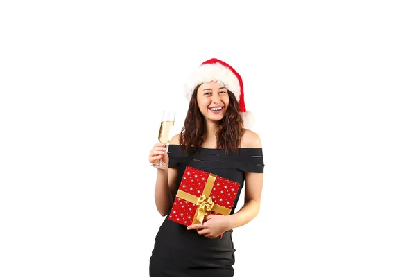 身に着けている青いタイトなセクシーなドレス サンタ クロース帽子飲むシャンパンとクリスマスを祝うの若い魅力的な女性のポートレート お祭りの背景 コピー領域をクローズ アップ クリスマス気分のコンセプト — ストック写真