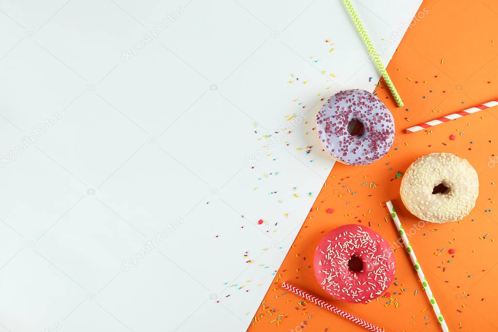 Minimal composition in vibrant colors with bright glaze donuts.
