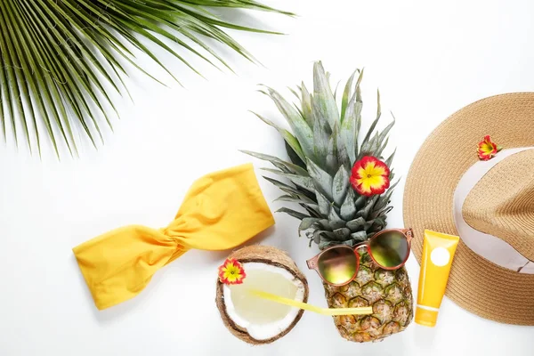 Exotic top view composition with items symbolizing summer mood.
