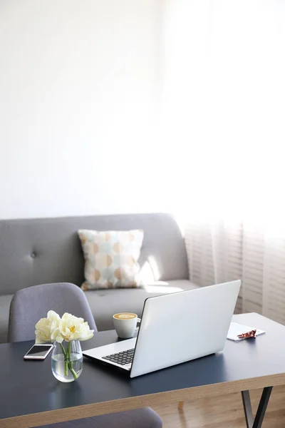 Feminine office space with a lot of ntural light.