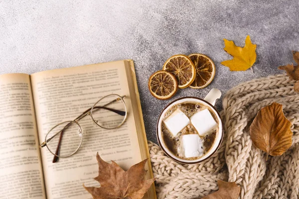 Autumnal top view composition with fall season symbolics on textured background.