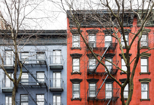 Blue and Red vintage style apartment buildings in the East Village neighborhood of Manhattan in New York City NYC