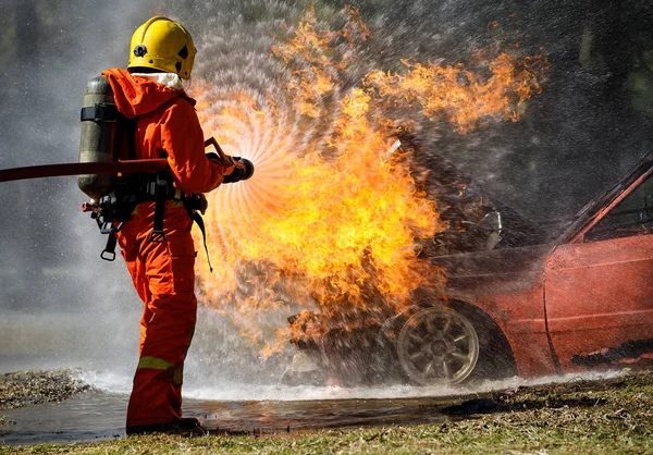 Fire Fighter Hosing Water Extinguish Fire Car Accident Road — Stock Photo, Image