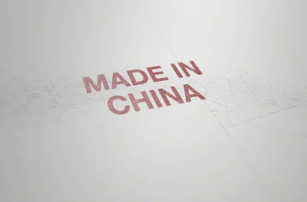 極端なクローズ アップ レンダリングを平らな白いプラスチックの製品に中国製の読み取りに表面摩耗印刷記号の — ストック写真