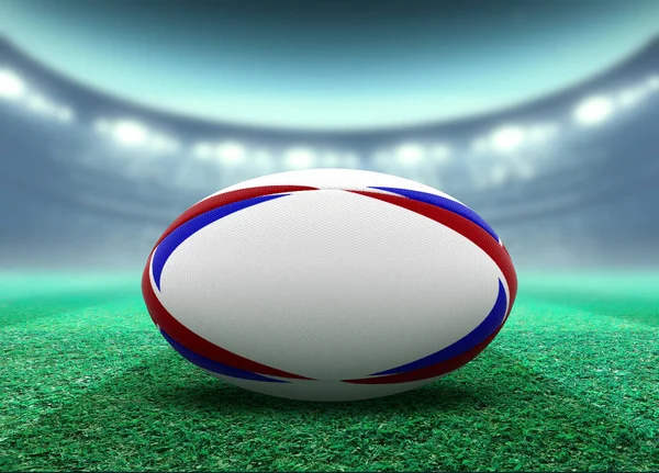 Stadio illuminato e palla da rugby — Foto Stock