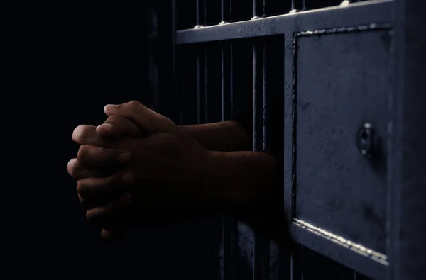 Jail Cell And Black Hands — Stock Photo, Image